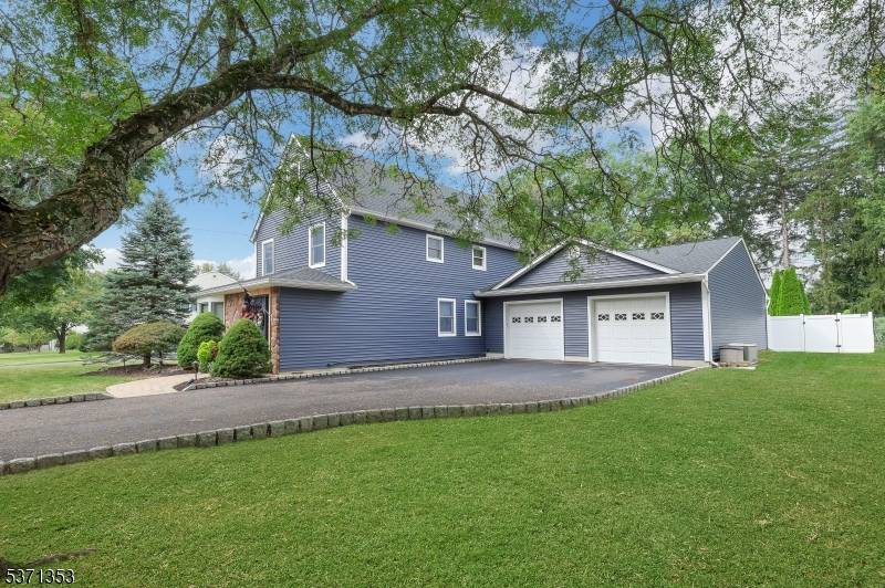 UPDATED AND RENOVATED colonial newer kitchen w ss appliances, quartz counters, renovated bathrooms, oversized 4 car garage, backyard oasis with gunite salt water pool w waterfall, concrete patio with permanent ...