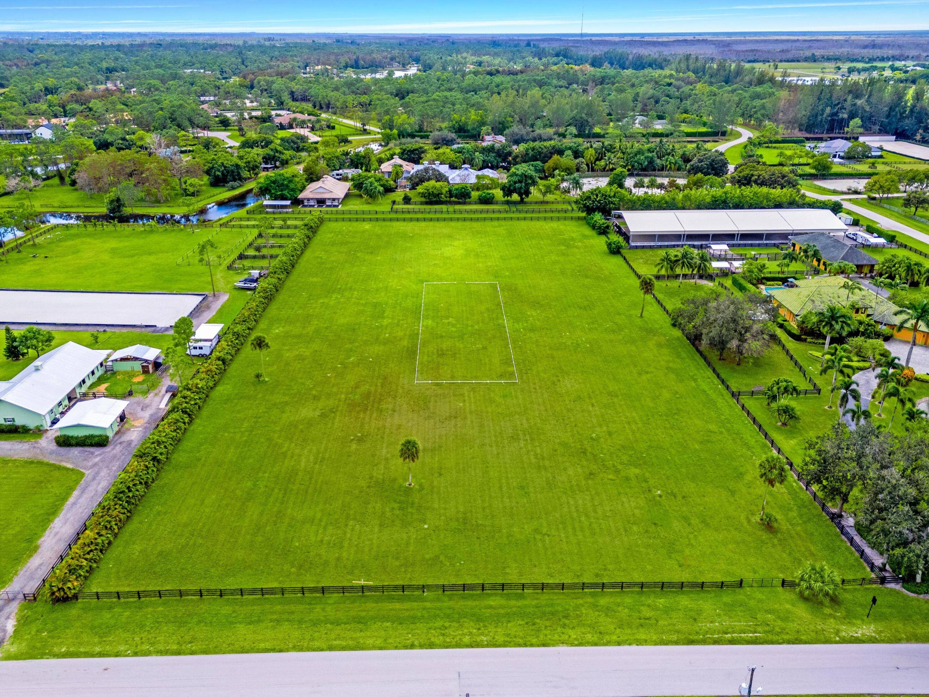 An exceptional opportunity to craft your luxury estate in the exclusive gated community of Homeland, just minutes from Wellington's renowned equestrian venues.