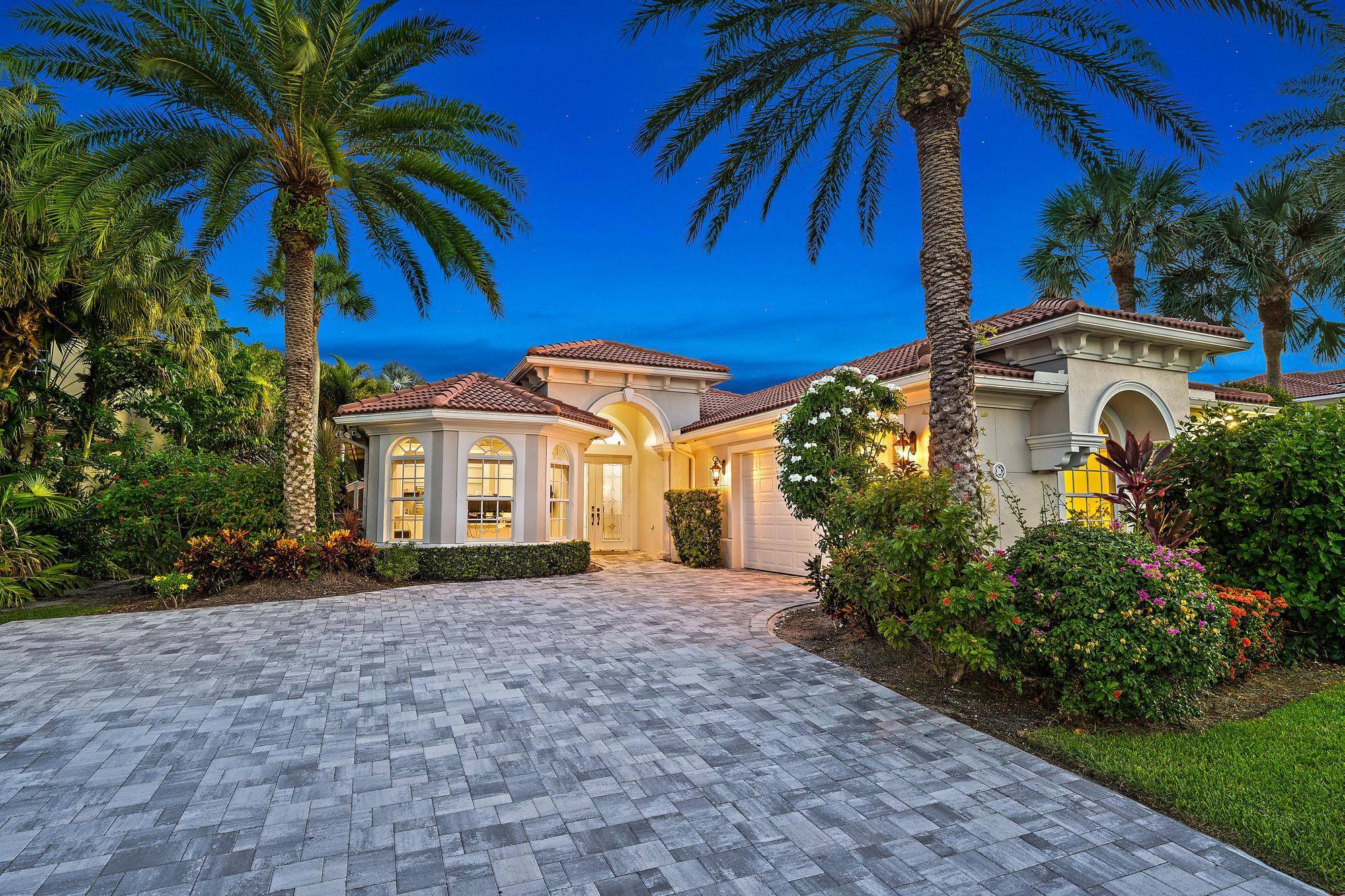LUXURIOUS, fully renovated single story CBS pool home nestled in the prestigious gated golf course community of Jupiter Country Club.
