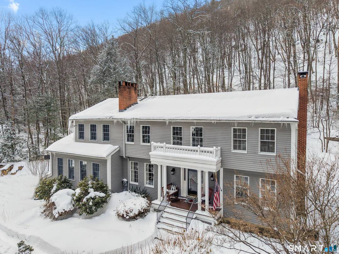 Experience timeless elegance and unparalleled privacy at this exceptional colonial estate, gracefully sited on 4.