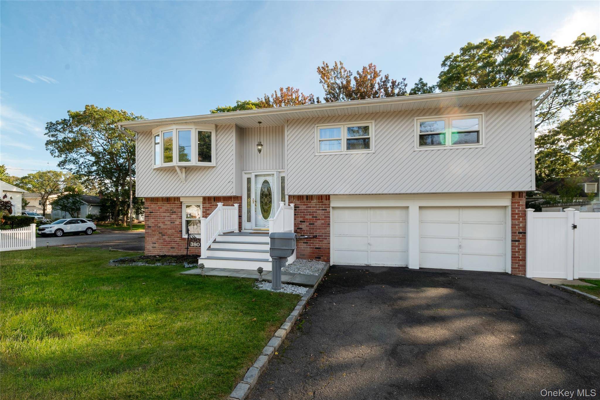 Welcome to this beautifully updated Hi Ranch nestled on a spacious corner lot in West Babylon.