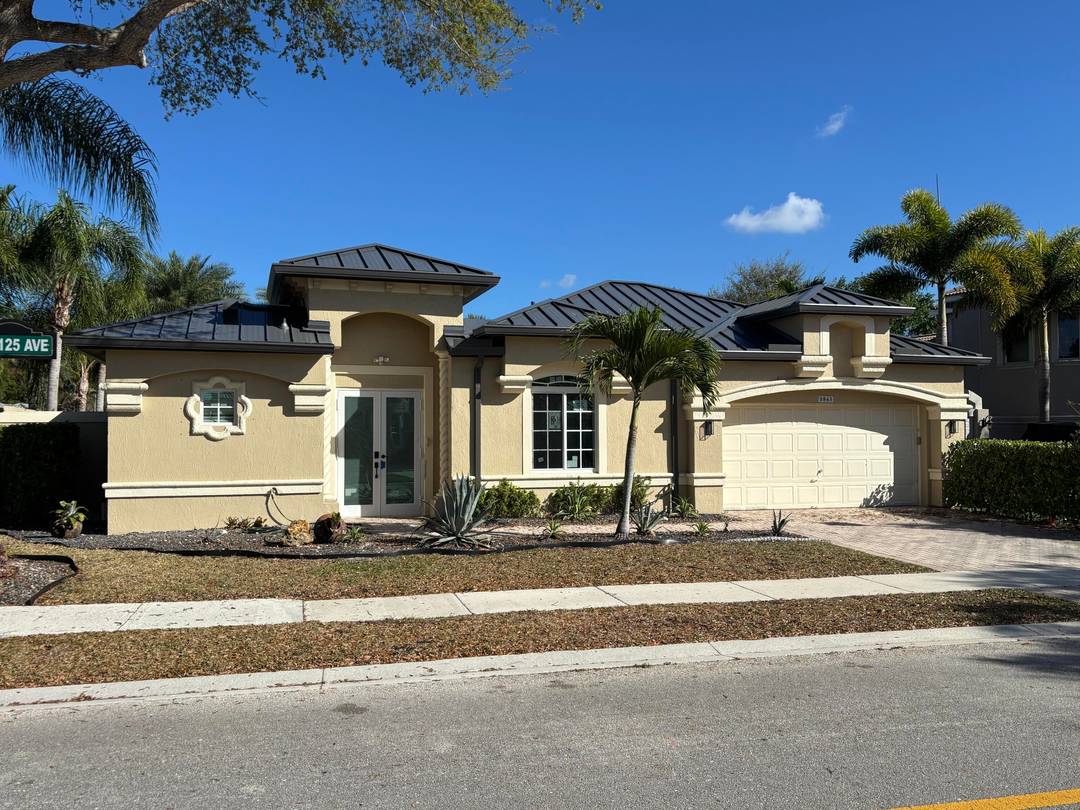 LOCATED IN HERON BAY AT THE POINTE, BEAUTIFULLY REMODELED 5 BEDROOM 3 BATH HOME WITH 2 CAR GARAGE, NEW ROOF AND NEW IMPACT WINDOWS.