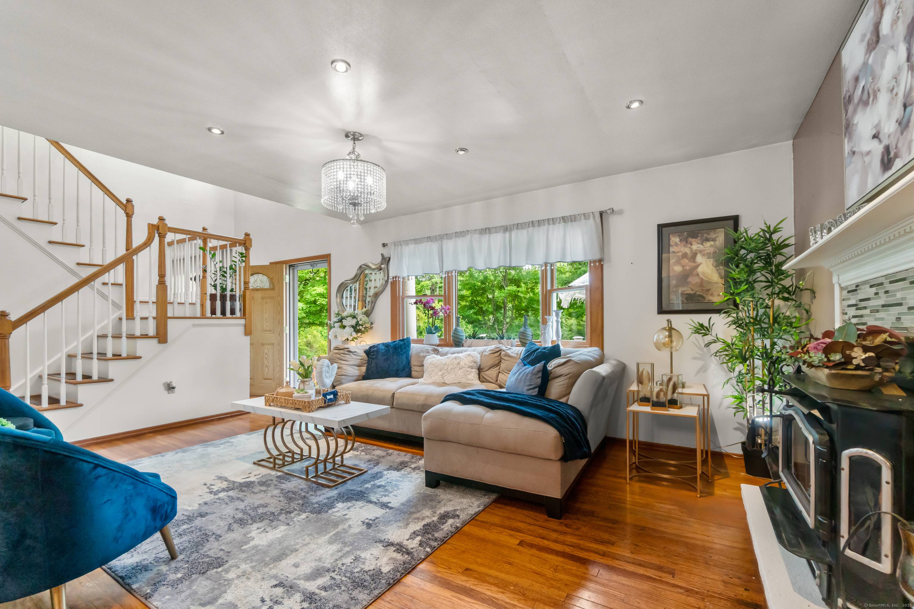 Move in ready and beautifully cared for, this classic Colonial sits on a private, scenic 2 acre lot in one of Newtown's most desirable neighborhoods.