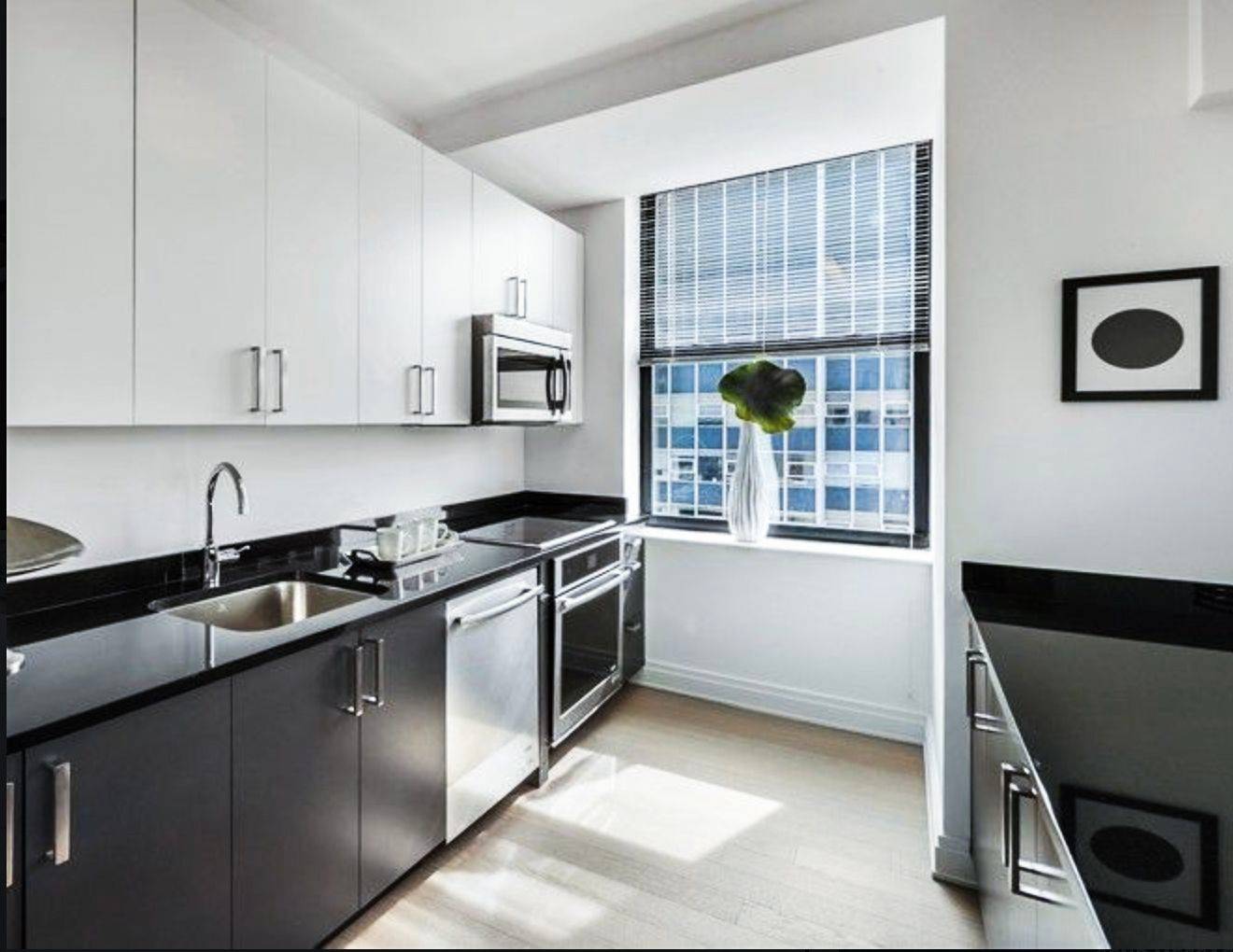 Sprawling high floor 2 bedroom with breathtaking south and east views of NYC.