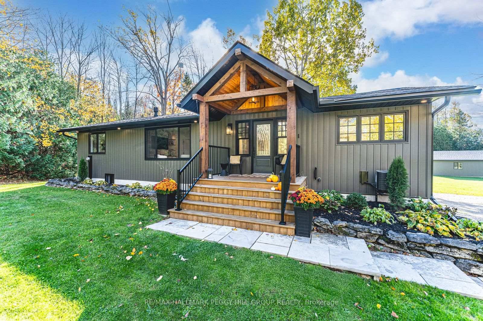 TURNKEY BUNGALOW ON 2 ACRES WITH HOT TUB, WALKOUT BASEMENT, DECK amp ; DESIGNER FINISHES !
