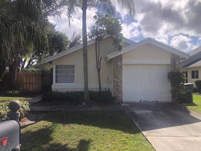 Three bedroom two bath corner home with large side lot one car garage home has just been totally renovated brand new tile, flooring, painting.