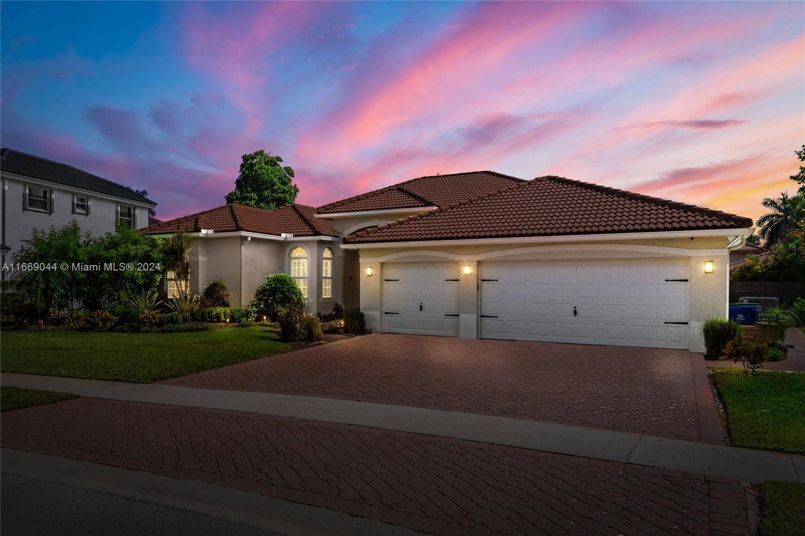 This stunning home is nestled in the desirable community of Sunset Lakes.
