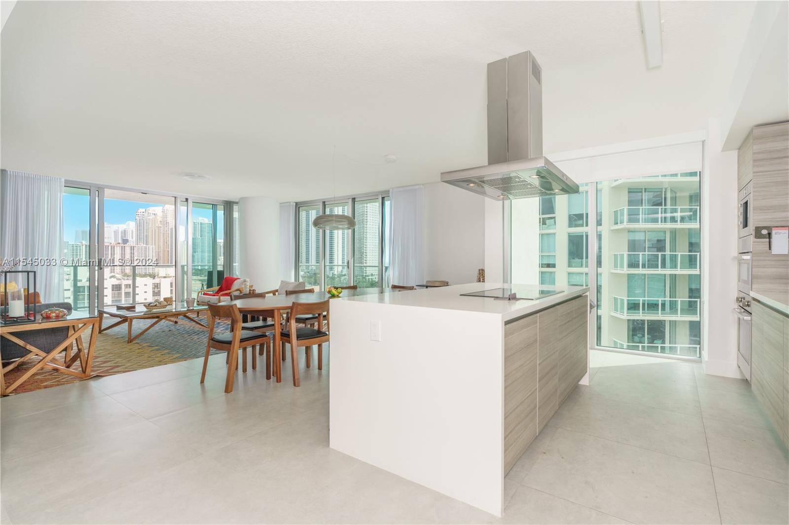 MOTIVATED OWNER ! Panoramic views of Sunny Isles Beach and the Atlantic Ocean from the oversized wrap around balcony of this stunning 3 bedroom ALL SUITES 3.