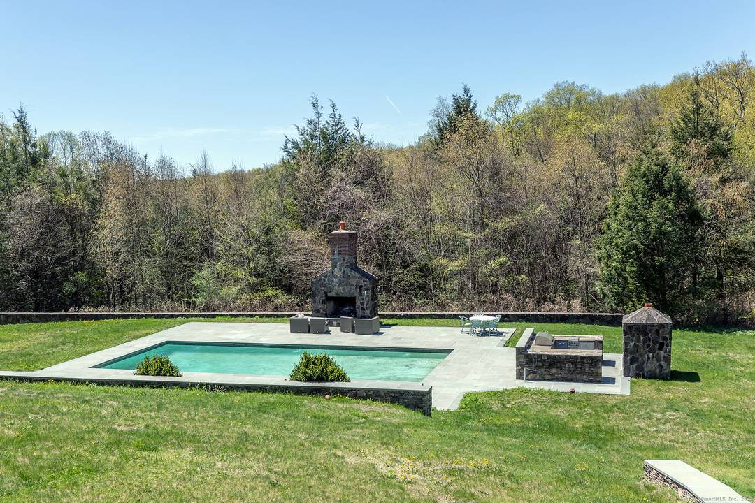 Long gracious driveway leads you to the formal yet comfortable country house set privately on the property for peaceful enjoyment.