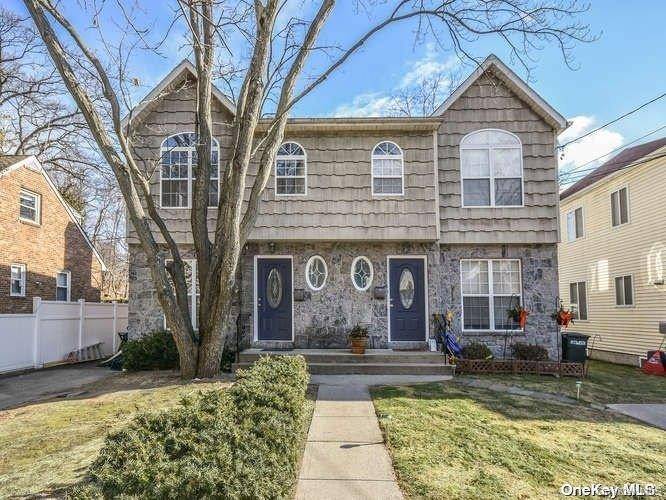 Beautiful Duplex featuring living room w fpl, dining area, eat in kitchen and powder room on the main level.