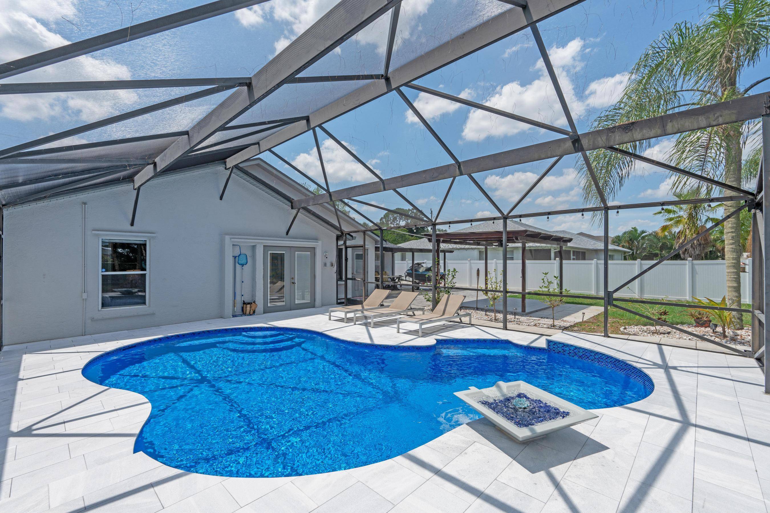 Completely Renovated 4 Bedroom Canal Home with Stunning Pool Smart FeaturesThis beautifully updated 4 bedroom, 2 bathroom home sits on a peaceful canal and offers the perfect blend of luxury, ...