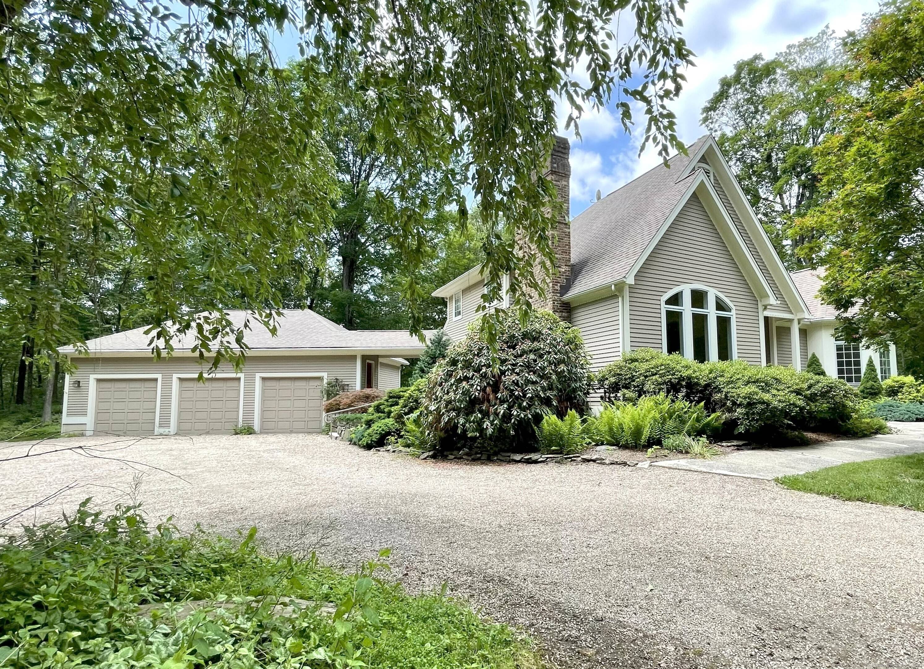 This much admired residence is privately located on a quiet country road, with 3 plus acres of lawn and light woods lined by old stone walls.