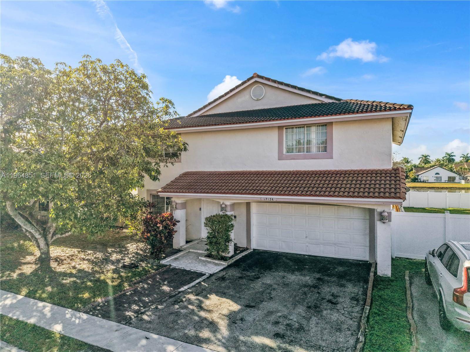 THIS IS IT ! Experience elevated living in this gorgeous waterfront home located in Sawgrass Estates North.