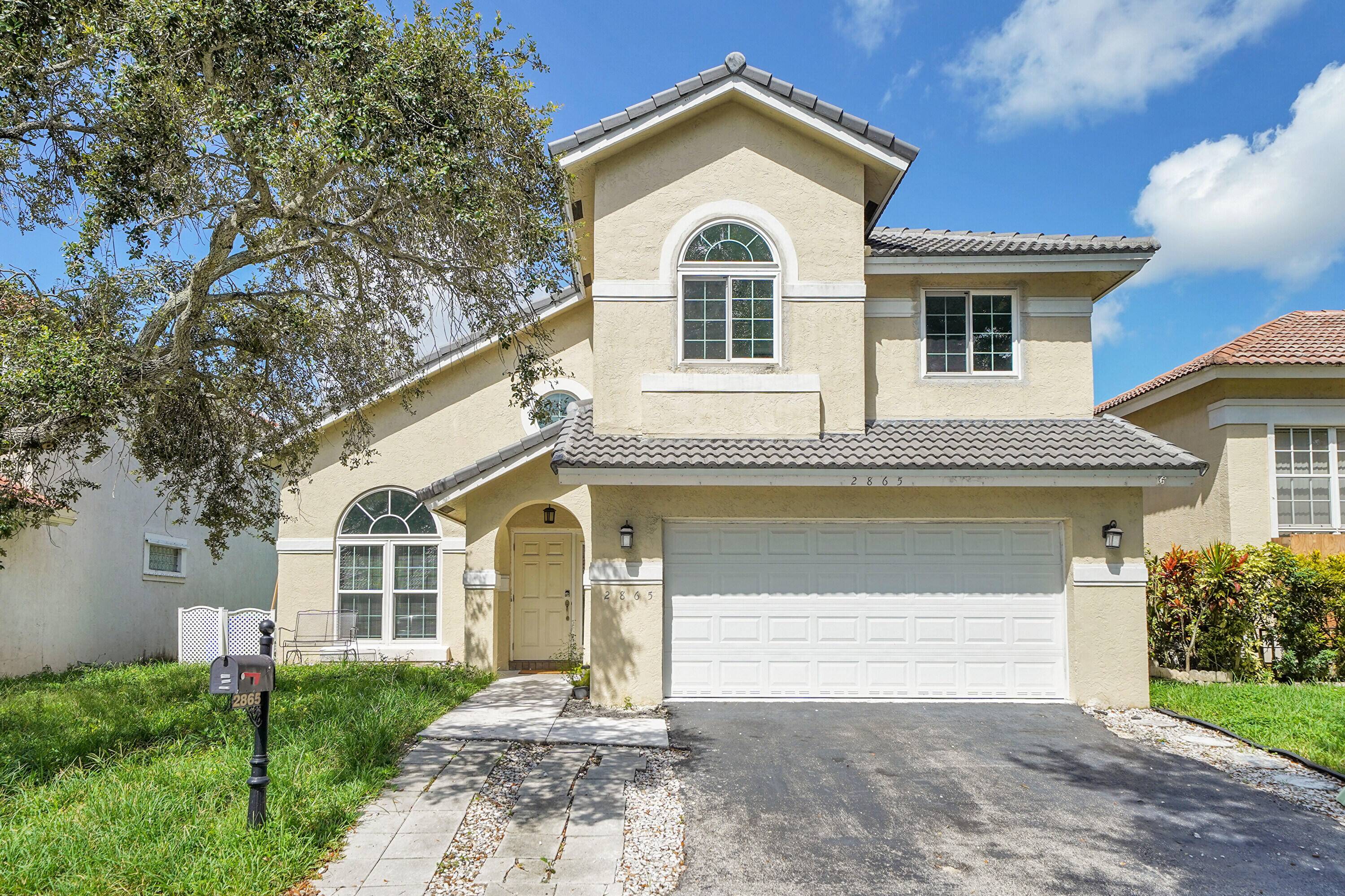 Step inside this spacious and elegant home in the highly sought after Coral Lakes Estate Community.