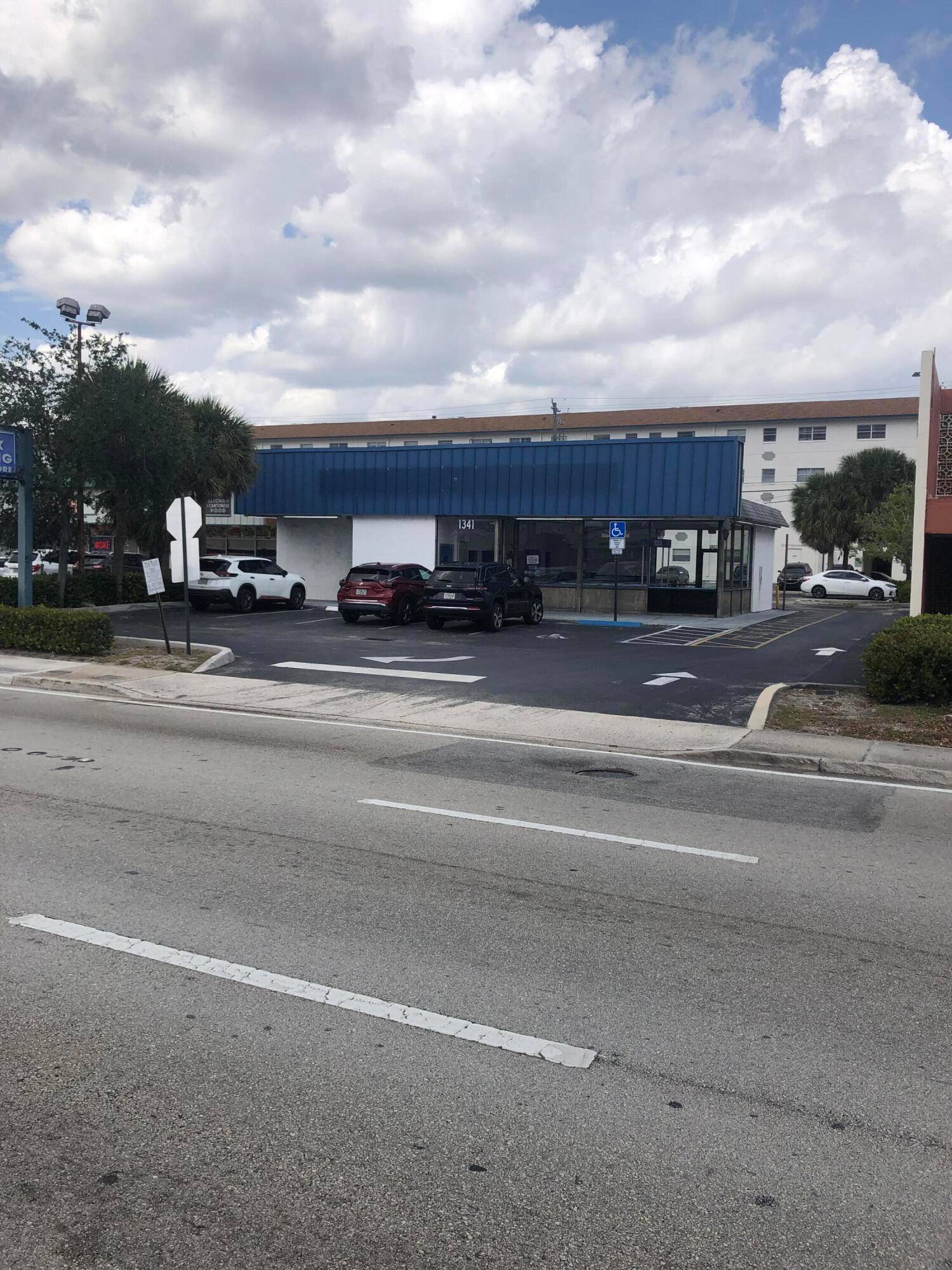 Commercial property with vacant freestanding building located between Dixie Highway and Federal Highway on busy Commercial Blvd.