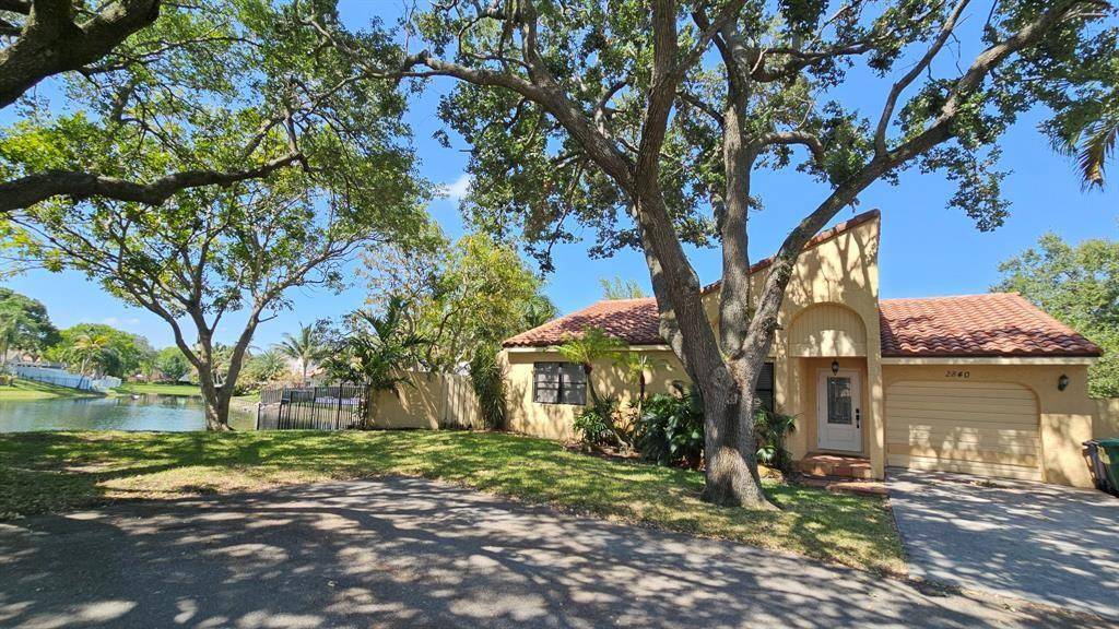 Tucked away at the very end of a quiet cul de sac in the heart of Rock Creek, this Cooper City home has privacy, peace, and a spectacular lake view.