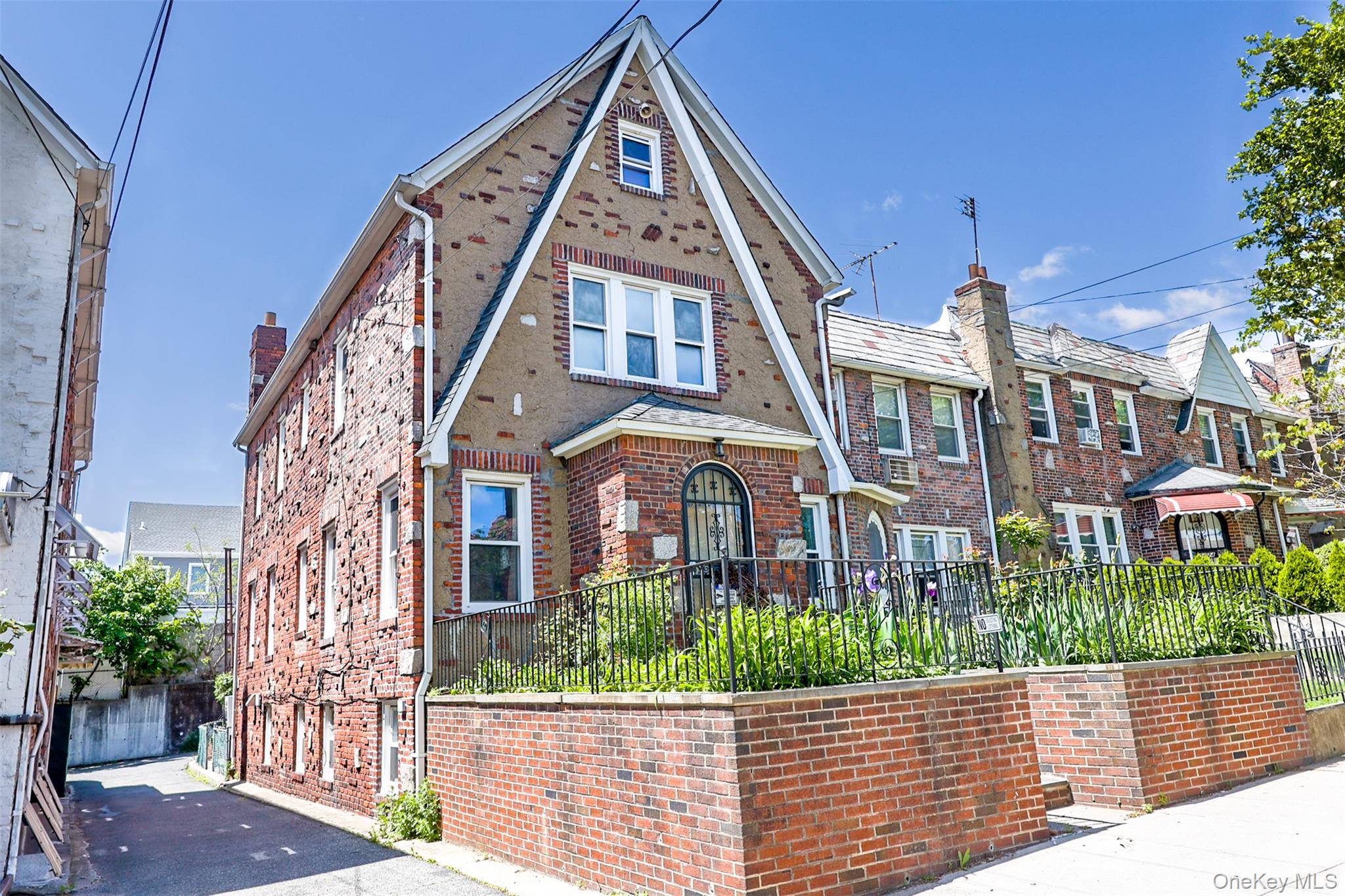 Welcome to this spacious and well maintained two family brick home, complete with driveway and garage.