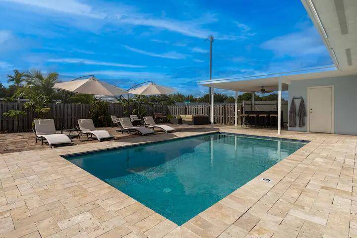 Fully furnished and remodeled classic, one story, 3BR 2BA beach home offered as a Seasonal Rental.