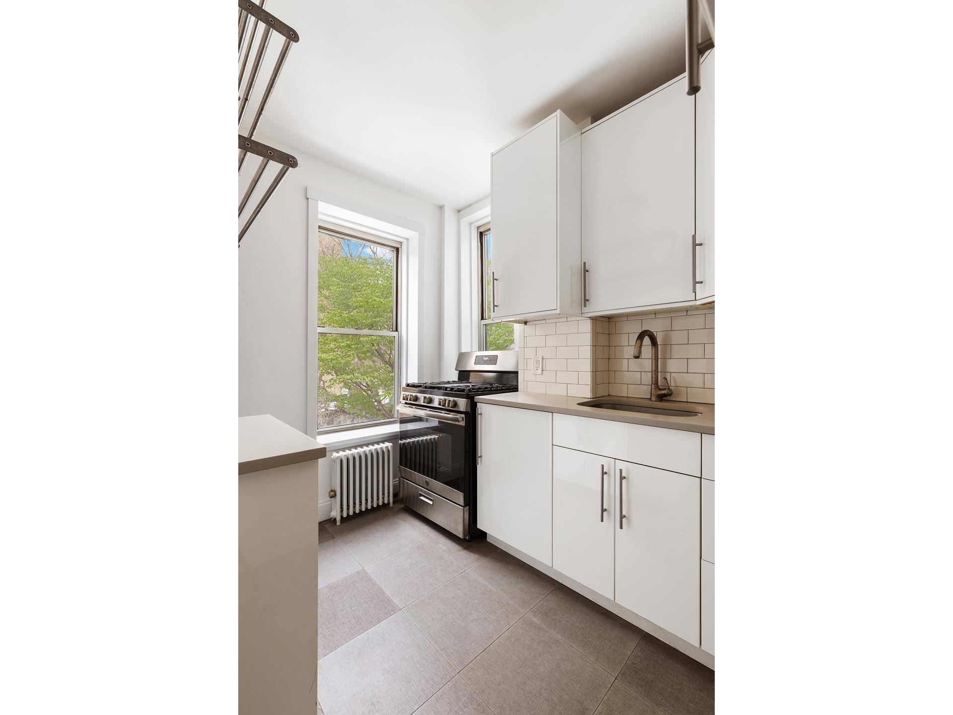 Bathed in natural light and wood floors throughout, this oversized 2 bedroom, 2 Bathroom apartment located within the heart of the East Village has been fully renovated and is the ...