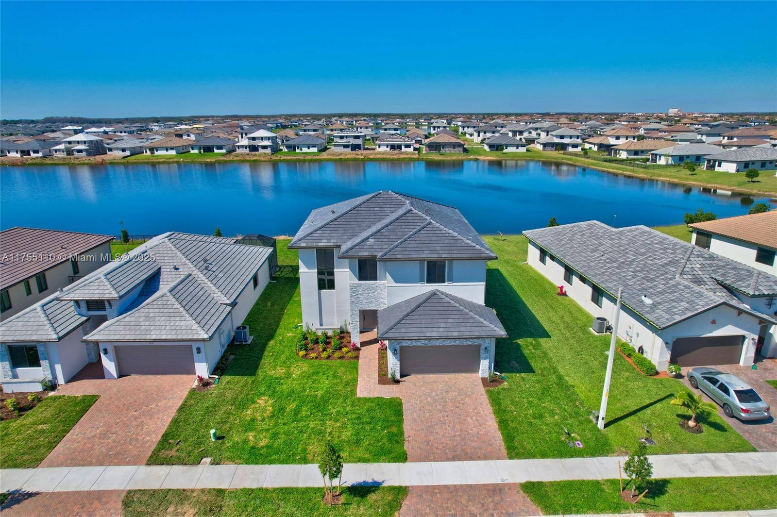 This never lived in 2025 Captiva Garden Collection Hanford model offers tranquil lakefront living in the beautiful Maple Ridge community of Ave Maria.