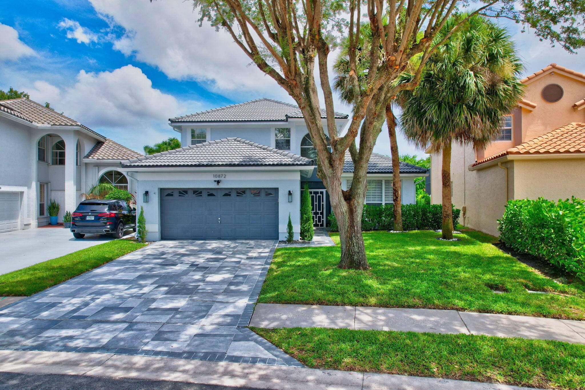 Make this fully remodeled waterfront pool home on a lake in Lakes at Boca Raton yours today.