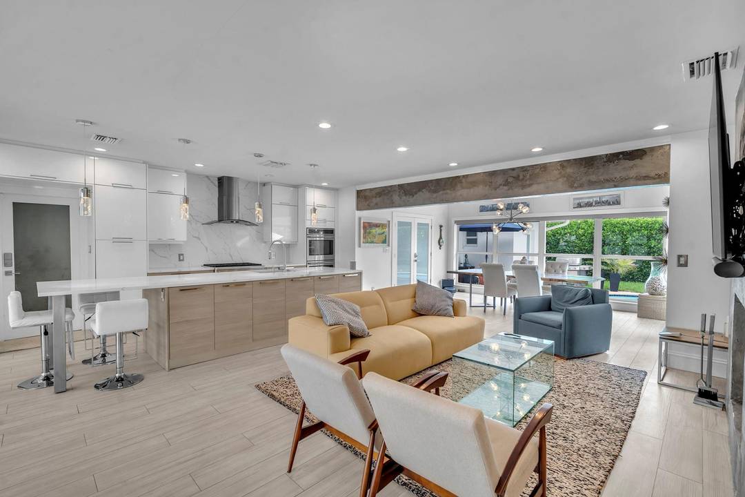 Experience coastal living at its finest in this stunning 4 bedroom, 3 bath home located just a short stroll from the beach.