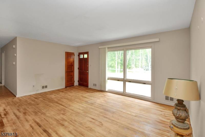 Welcome to this charming ranch nestled on nearly an acre of land, perfectly situated at the end of a quiet cul de sac and backing to scenic parkland.