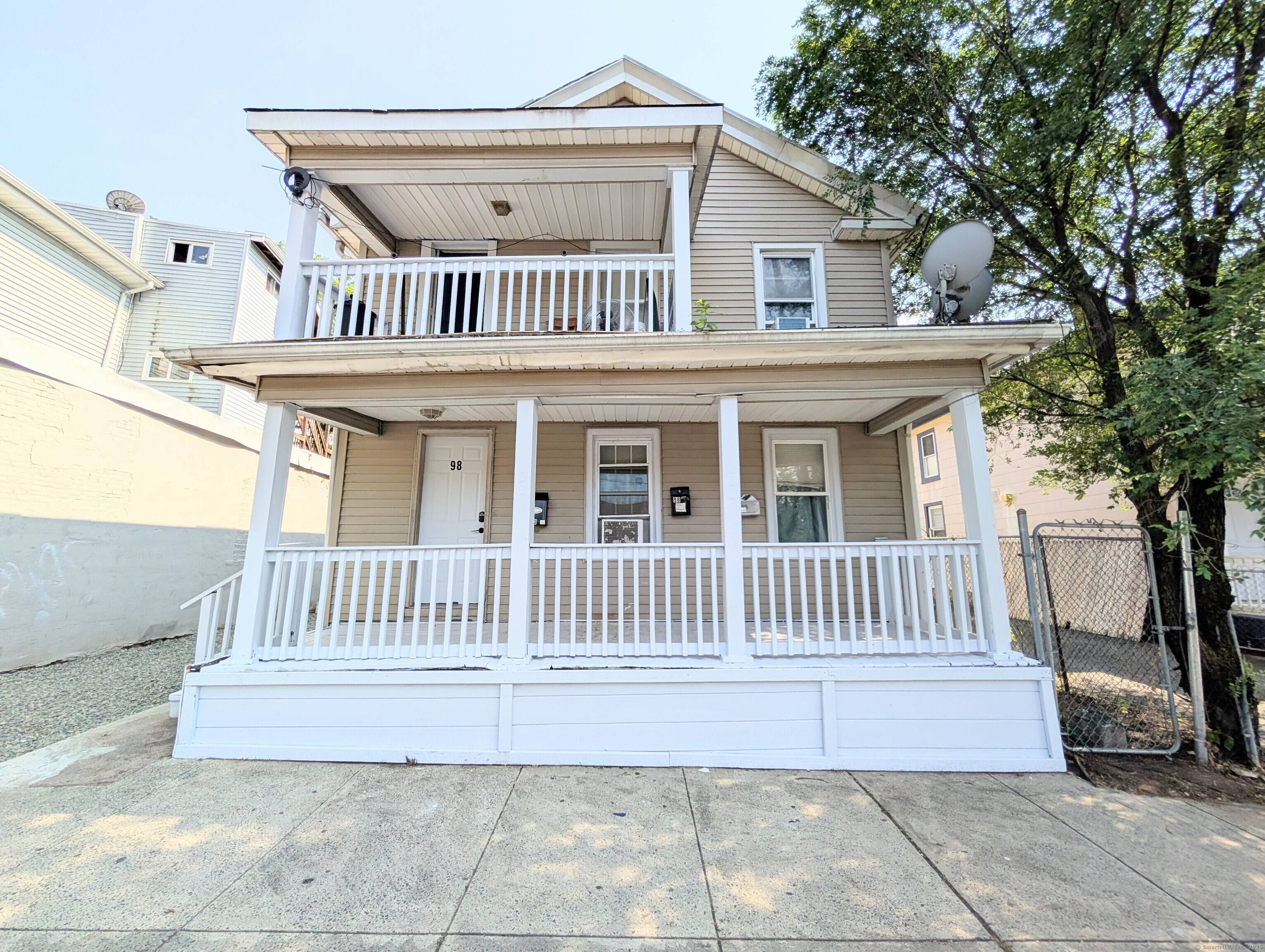 Unique double parcel 3 family with two identical 3 bedrooms apartments on the 1st and 2nd floors.