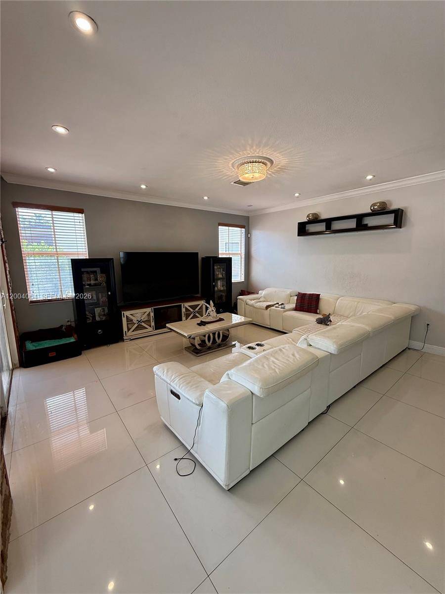 Beautiful and well kept two story Mediterranean style home in the highly desirable Century Gardens at Kendall.
