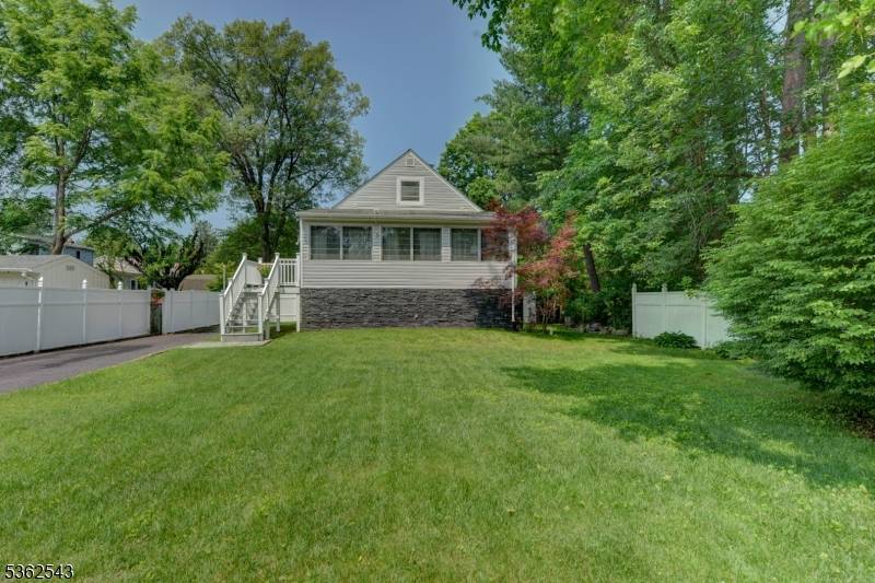 Charming cape cod in a desireable lake community called Rainbow Lake featuring fishing and row boating.