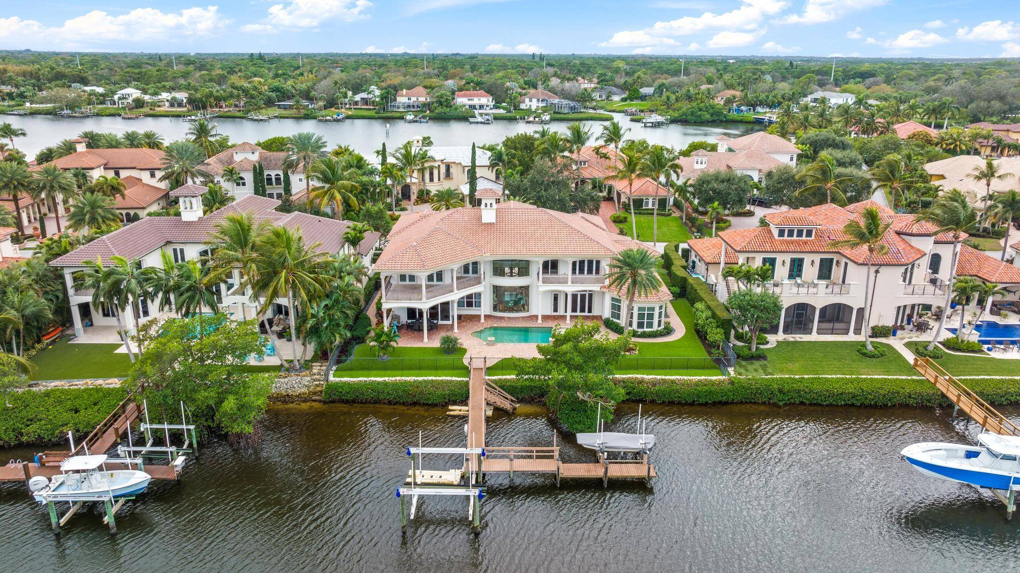 Enjoy breathtaking Easterly views of the wide water, overlooking the Loxahatchee River, from this exceptional home located on a private island in the prestigious Islands of Jupiter.