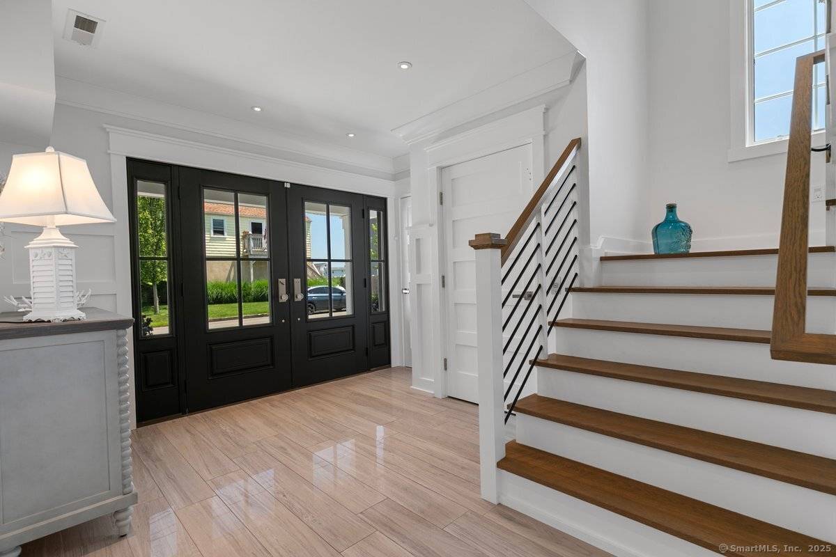 Never before listed. A rare opportunity to own a true coastal masterpiece 84 Cooper Avenue a custom built, luxury colonial in the sought after Silver Sands Beach enclave.