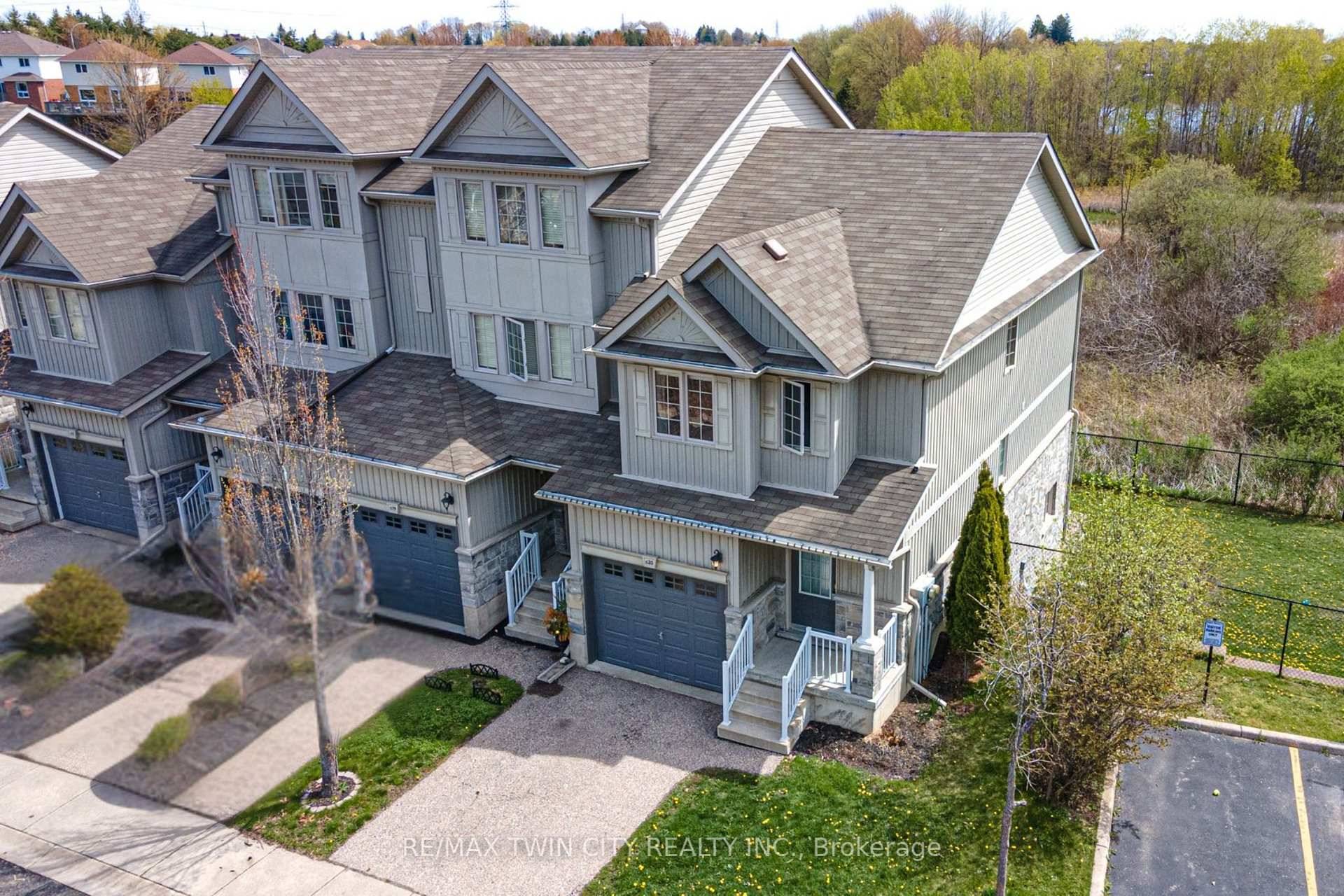 Welcome to C20 20 David Bergey Drive, Kitchener a meticulously maintained end unit townhouse situated in the highly sought after Laurentian Hills neighborhood.