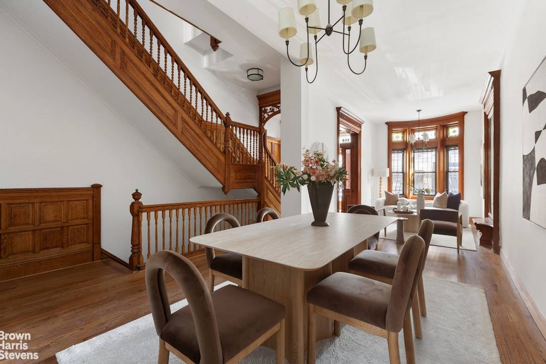 A grand townhouse defined by scale, light, and extraordinary original craftsmanship, this five bedroom residence with flexible potential for seven bedrooms delivers classic Harlem elegance at its most refined.