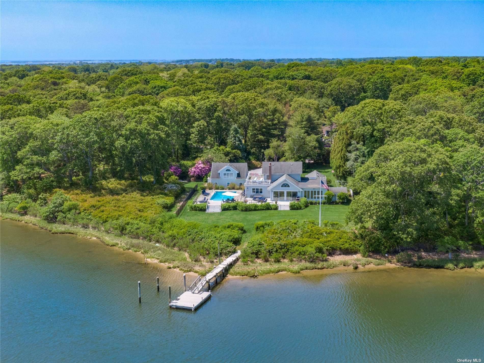 Boater's Paradise... Summer 2024 on Seatuck Cove Waterfront This charming, bay front home is ready for your summer retreat !