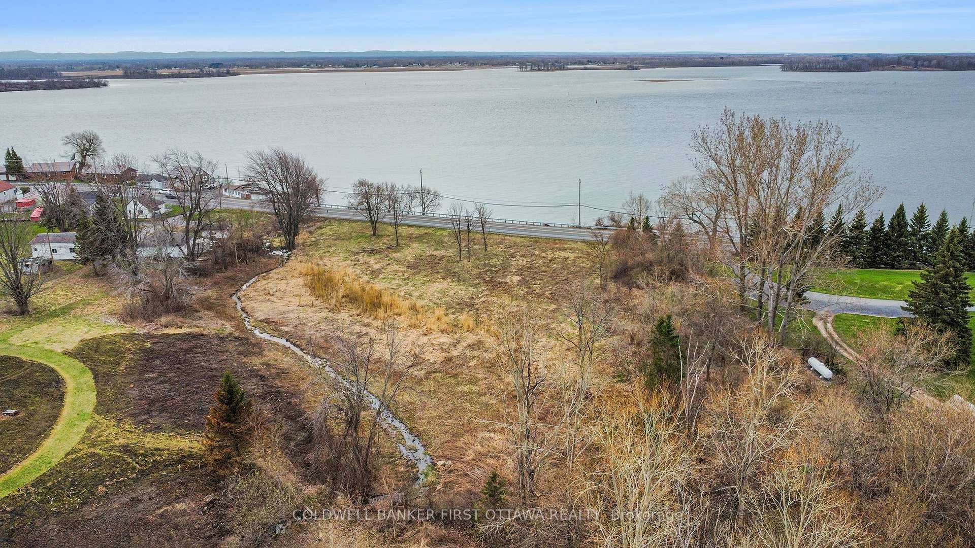 Presenting an Exclusive waterfront lot with 335 feet of prime frontage, offering breathtaking views of the St Lawrence River, Seaway and Adirondack Mountains.