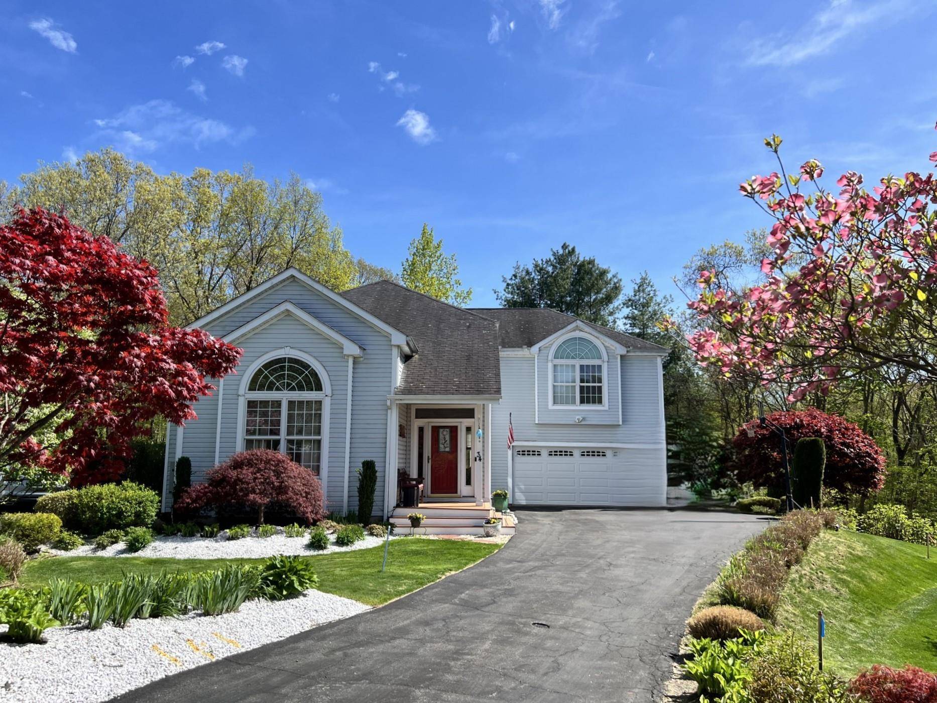 Welcome to this STUNNING and BEAUTIFULLY landscaped CONTEMPORARY COLONIAL located on a CUL DE SAC in sought after HUNTERS RUN, a 49 home, 67 acre, PRIVATE COMMUNITY.