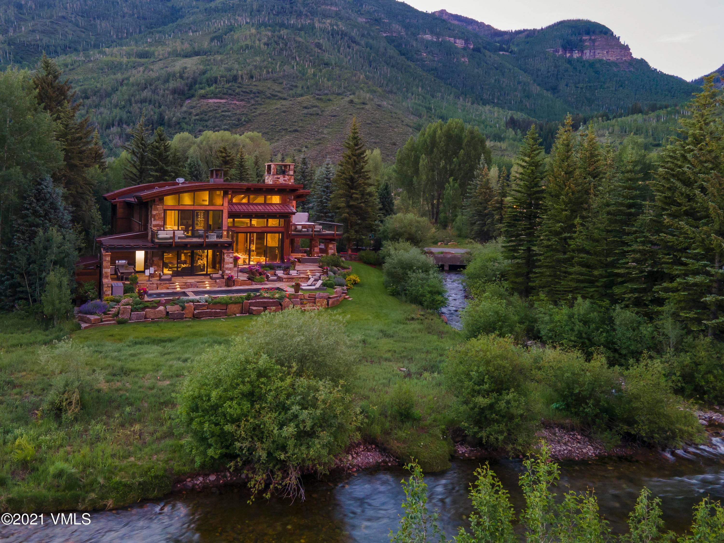 Enjoy your own private ''Betty Ford Gardens'' at this magnificent creekside residence.