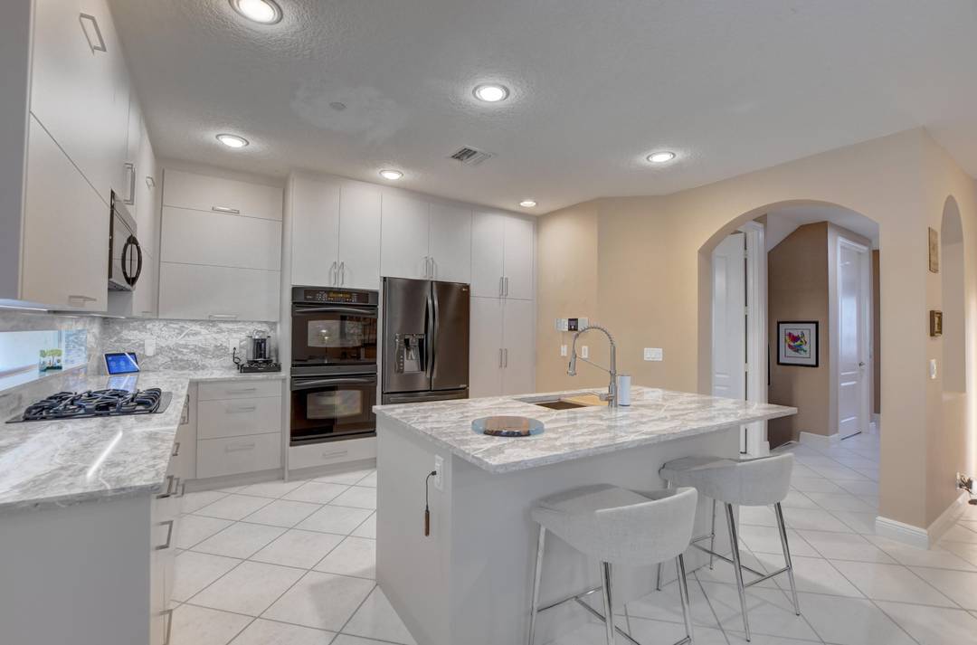 Nestled in the heart of Boca Raton, this distinguished three floor townhouse at 5545 NE Trieste Way offers an estimated 3200 square feet of upscale living space, thoughtfully designed for ...
