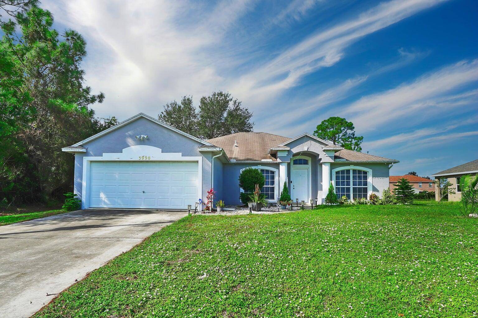 Welcome to this beautifully remodeled 4 bedroom, 2 bathroom home with a 2 car garage and NO HOA, located in one of Port St.