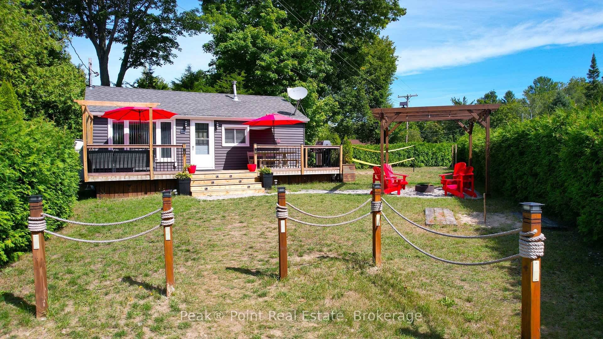 This delightful North Sauble Beach offers a perfect blend of comfort and functionality across two floors.