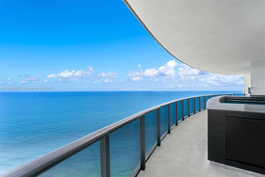 Drive your car into your oceanfront living room w Porsche Design Tower s iconic luxury car elevator !