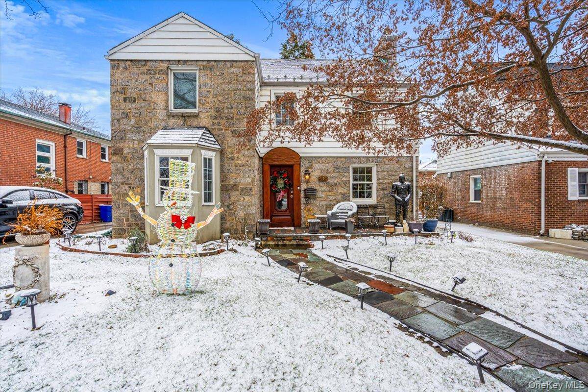Beautifully maintained home in the heart of Flushing, featuring a legal extension for extra space.