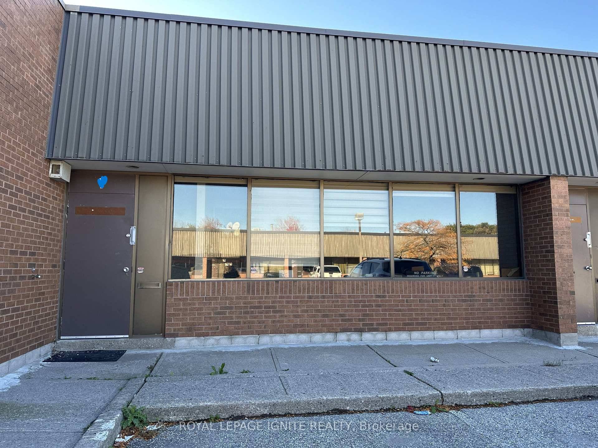 Prime industrial unit for lease featuring a professional front office and a spacious warehouse at the back with 53 ft trailer access and immediate access to Highway 401.