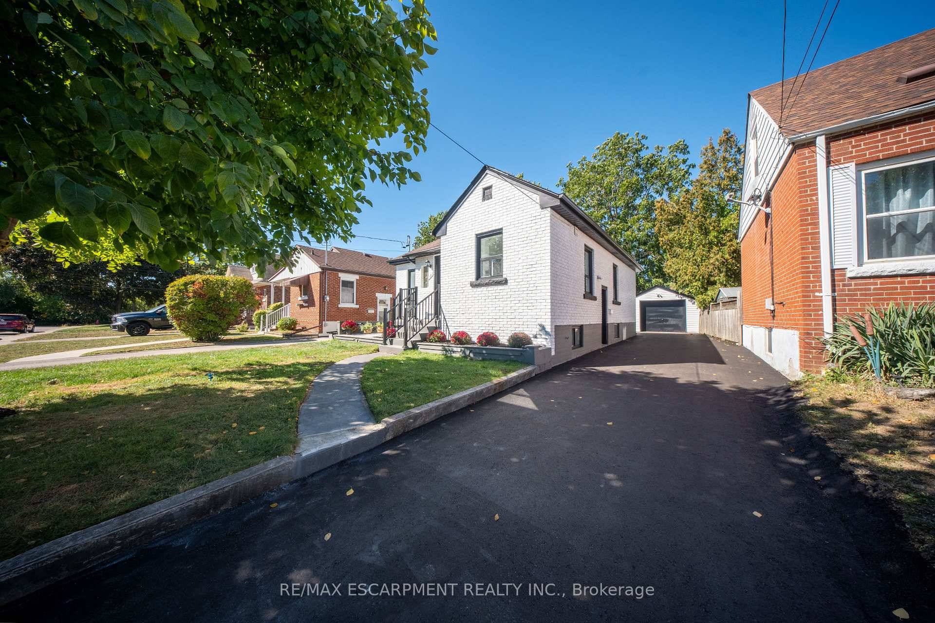 Location is key with this Fully Remodelled Brick bungalow with a Legal Additional Dwelling Unit ADU and a detached Garage with 5 Total Parking spaces, Features 3 2 beds, approx.