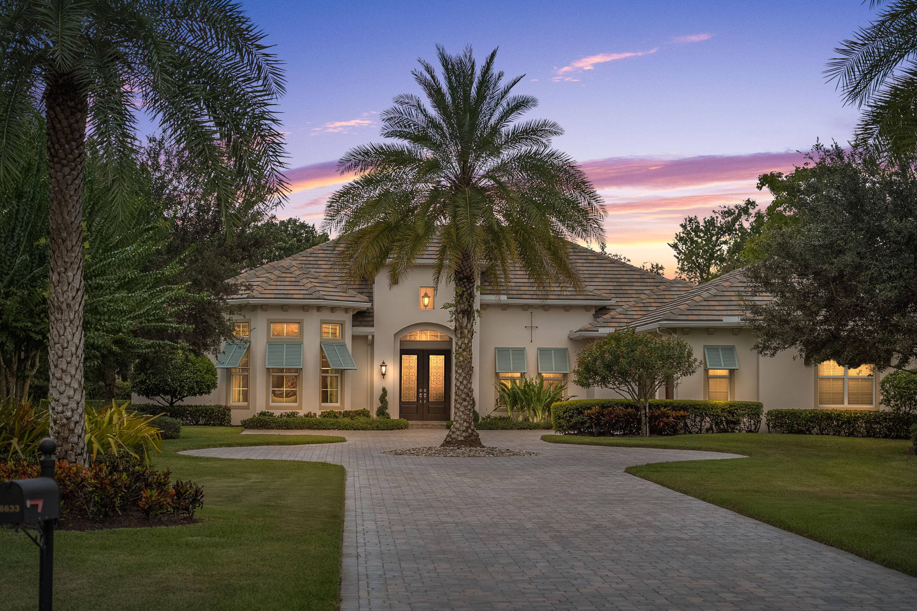 Stunning Arthur Rutenberg waterfront home in Palm City's gated Highlands Reserve.