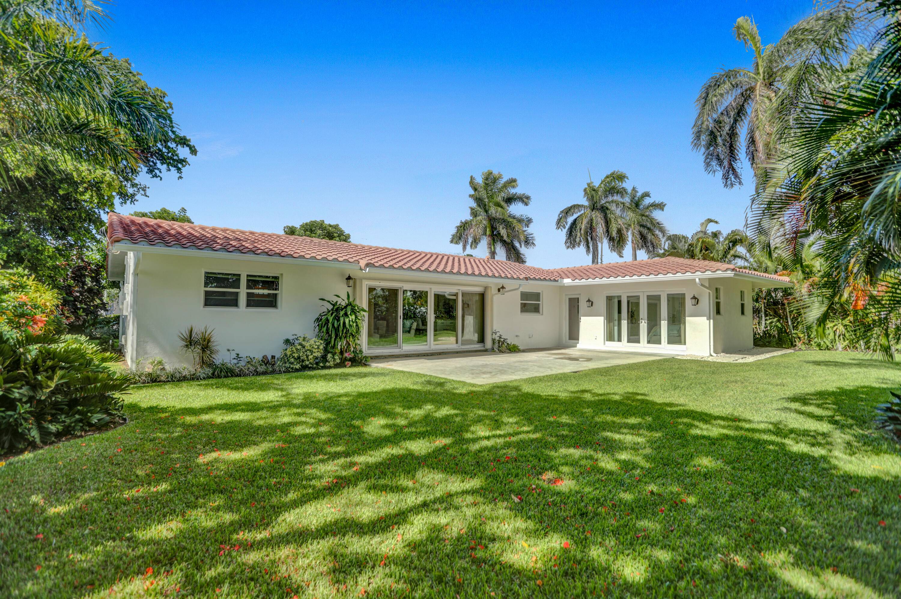 Beautiful, light flooded four bedroom, three bathroom home in the sought after Boca Harbour neighborhood of Boca Raton.
