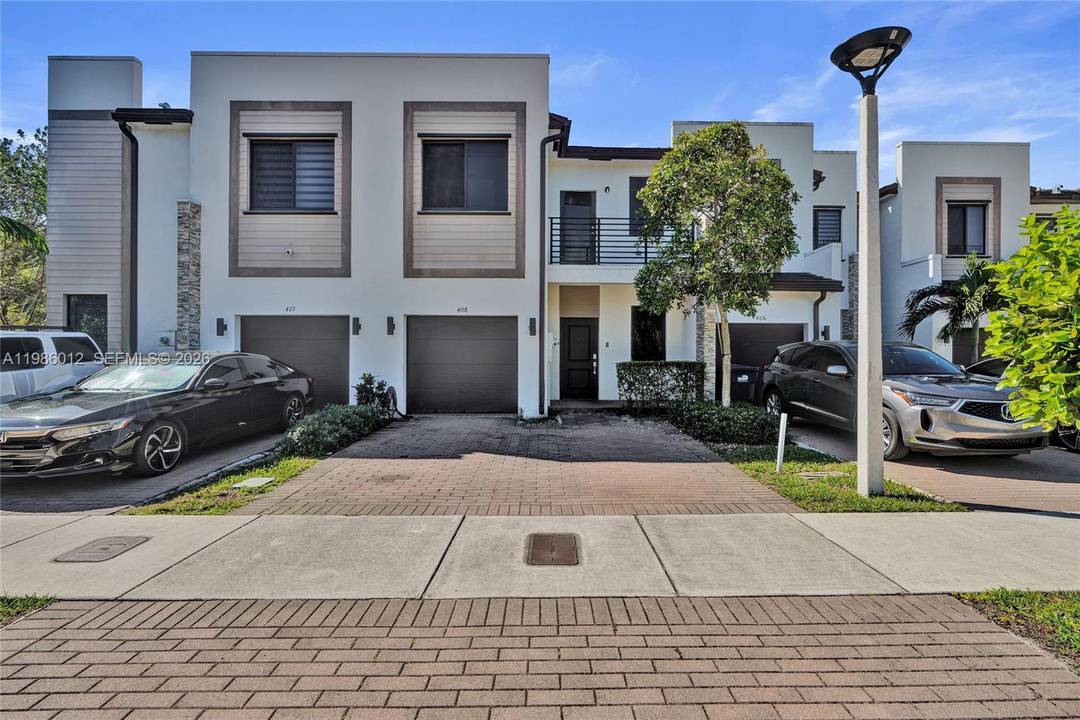 Spacious 4 bedroom, 2. 5 bath home featuring a fenced backyard, one car garage, and two additional parking spaces conveniently located right in front.