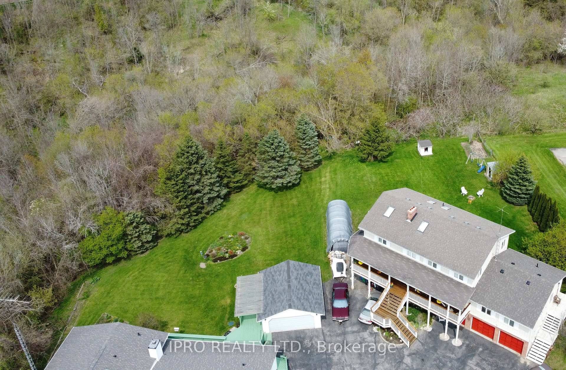 One of a Kind Custom Built Home on a Ravine Lot With an In Law Suite and Above Ground Apartment.