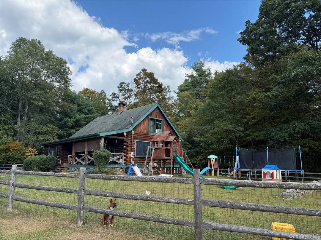 Inviting Log Home Retreat with Brook amp ; Pond.